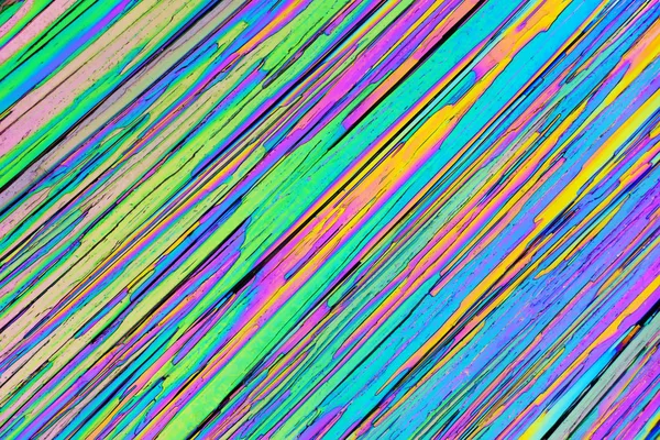 Colorful micro crystals in polarized light. Photo through a micr — Stock Photo, Image