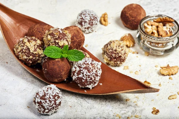 Delicious chocolate truffles. Biscuit cakes in a shape of balls. Traditional Russian cakes Kartoshka.