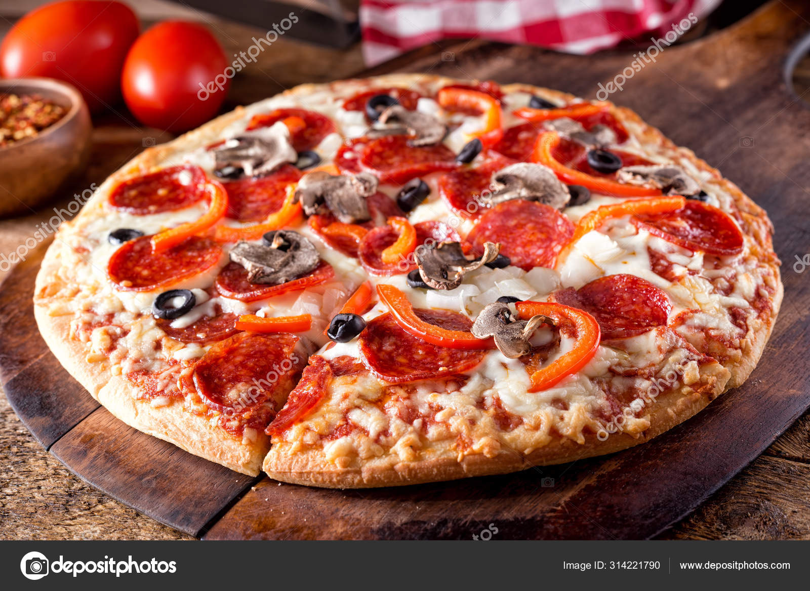 Deluxe Brick Oven Baked Pizza Stock Photo by ©fudio 314221790