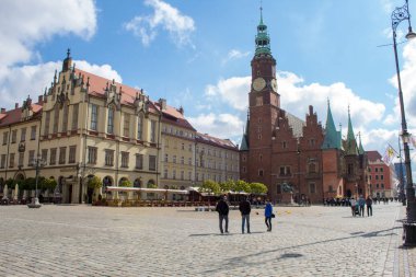 Wroclaw / Poland - April 22 2019: The colorful architecture of the famous Polish city of Wroclaw - Market Square, Town Hall.