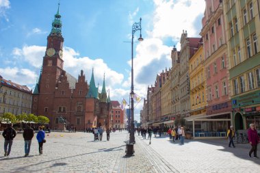 Wroclaw / Poland - April 22 2019: The colorful architecture of the famous Polish city of Wroclaw - Market Square, Town Hall.