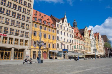 Wroclaw / Poland - April 22 2019: The colorful architecture of the famous Polish city of Wroclaw - Market Square, Town Hall.