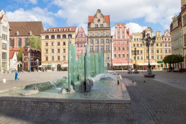 Wroclaw / Poland - April 22 2019: The colorful architecture of the famous Polish city of Wroclaw - Market Square, Town Hall.