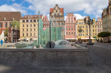 Wroclaw / Poland - April 22 2019: The colorful architecture of the famous Polish city of Wroclaw - Market Square, Town Hall.