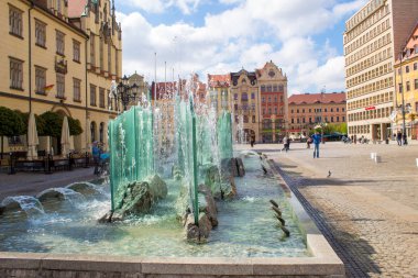 Wroclaw / Poland - April 22 2019: The colorful architecture of the famous Polish city of Wroclaw - Market Square, Town Hall.