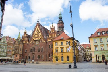 Wroclaw / Poland - April 22 2019: The colorful architecture of the famous Polish city of Wroclaw - Market Square, Town Hall.