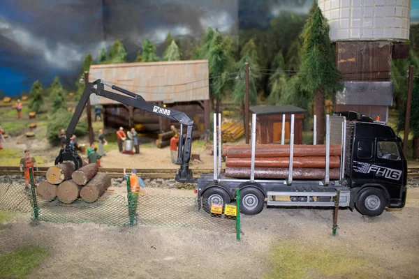 Layout or miniature of the railway, trains, rails and railway station, miniature scenes of work of railway workers.