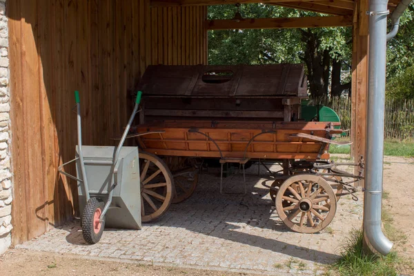 Ancient agricultural machinery and vehicles, a cart made of wood and metal farmers from Europe.