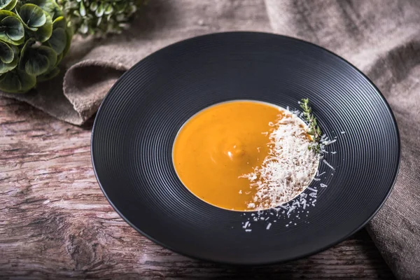 Portion Cream Pumpkin Soup Garnished Cheese Herb Wooden Table — Stock Photo, Image