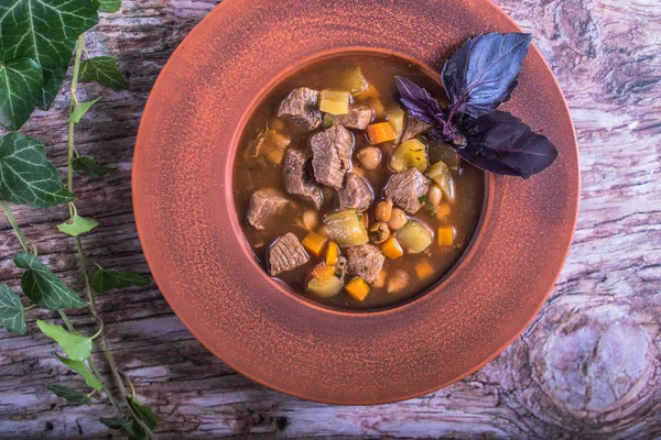 Meat and vegetable soup served in plate on wooden table — Stock Image Meat Vegetable Soup Served Plate Wooden Table Stock Photo
