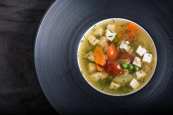 Vegetable soup with cheese served on black plate — Stock Image Vegetable Soup Cheese Served Black Plate Stock Photo