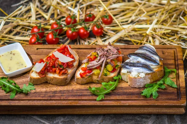 Bruschetta Snacks Vegetables Anchovy Served Wooden Board — Stock Photo, Image