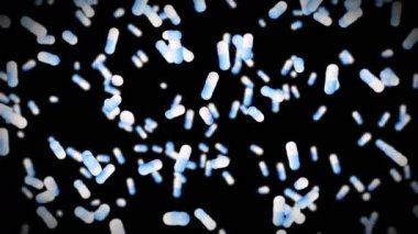 Siyah arka planda bir sürü tıbbi kapsül uçurmak. Tıp ve eczacılık konsepti. Mavi hap kapsülünün 3 boyutlu animasyonu dönüyor. Döngü canlandırması.