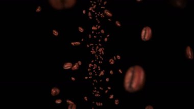Siyah arka planda kahve çekirdekleri uçurmak. Kafein içeceği, kahvaltı, Aroma. Üç boyutlu kavrulmuş kahve çekirdeği animasyonu. Döngü canlandırması.
