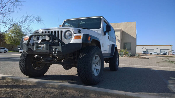 Jeep wrangler off road unlimited rubicon recon in desert motor car in the city street
