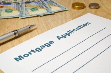 Bir kalem ve para ile Mortgage uygulaması.