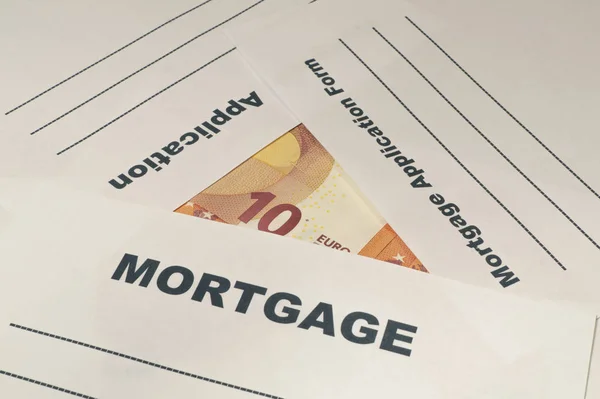 Mortgage application form with money on the table. — Stock Photo, Image