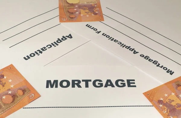 Mortgage application form with money on the table. — Stock Photo, Image