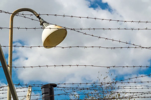 Lantern and barbed wire with connected electricity. — Stock Photo, Image