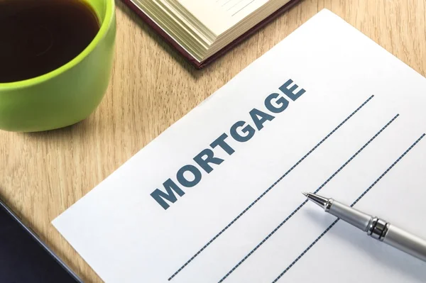 A mortgage template to fill out with pen and coffee — Stock Photo, Image
