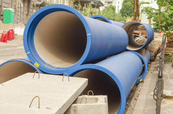 Corrugated water pipes of blue color, large diameter, prepared for laying.