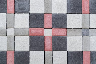 İnşaat için farklı renklerde kaldırım tuğla doku. Bina malzemesine bakan.