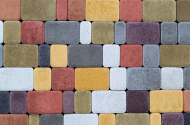 İnşaat için farklı renklerin kaldırım taşları duvar dokusu. Bakan yapı malzemesi.
