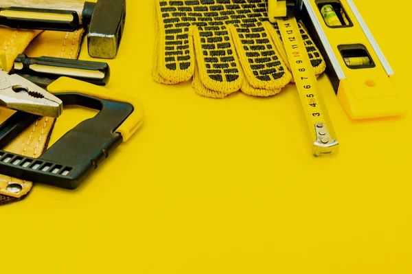 Professional tools for the master builder on a yellow background.