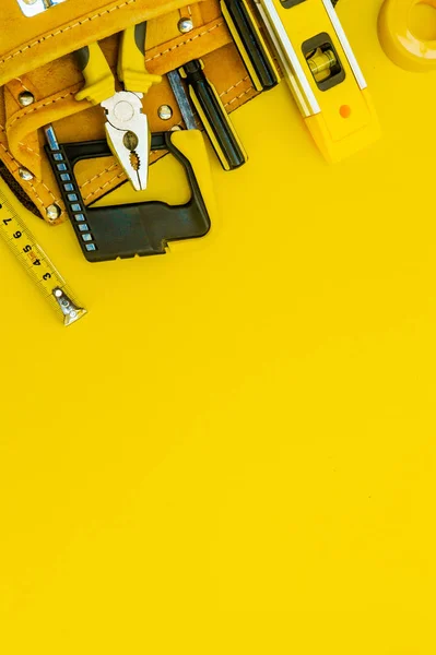 Professional tools for the master builder on a yellow background.