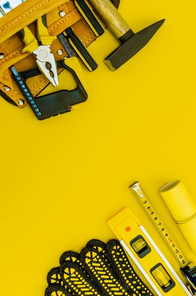 Professional tools for the master builder on a yellow background.