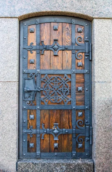 Ancient doors of the entrance to the dungeon of Vladimir hill in Kiev