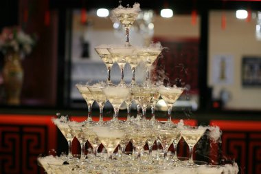 Pyramid of champagne glasses. In holliday clipart
