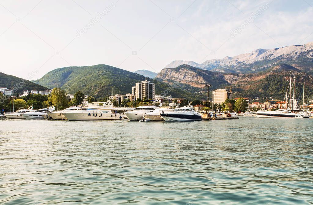 Marina for sailing yachts and boats with a view of the city of Budva and the Balkan Mountains, Budva Riviera, Montenegro.