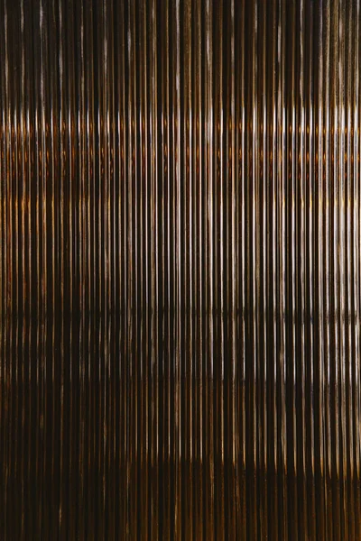 Stripped metal texture. Abstract golden background.