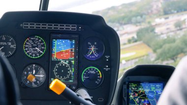 Orlando FL, United States - December 31, 2024: Inside helicopter cockpit, advanced instruments and displays provide crucial navigation and flight data for pilots