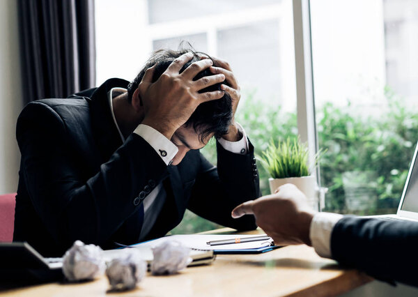 Businessmen failure project serious with boss talking deadline at office room with paperwork report on working table
