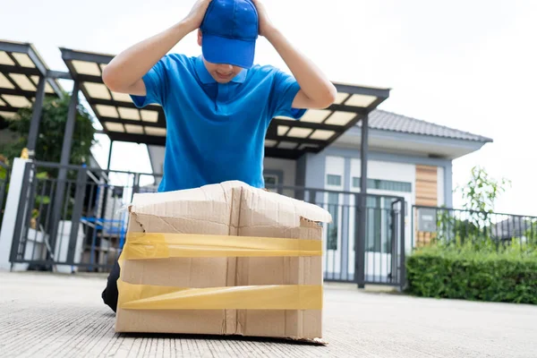 Delivery man Frightened with cardboard box damaged broken accident before delivering to customers at home, Express service client online shopping comfortable payment package product.