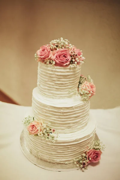 wedding cake on the table. Beautiful Colorful Sweet Wedding Cake Cupcake Decor Closeup Image at Event Space