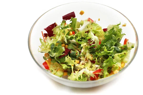 Fresh salad in a glass bowl. Salad. Organic food. Healthy vegetable salad with escarole endive, frisee endive, chicory radicchio, lettuce in a glass bowl. Vegetarian food. — Stock Photo, Image