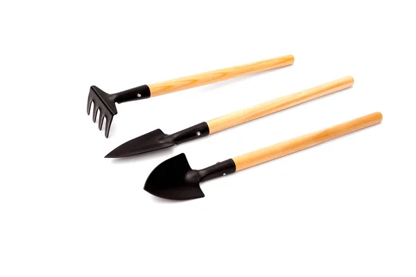 Conjunto de herramientas de jardín aisladas sobre fondo blanco y camino de recorte. pala, rastrillo . — Foto de Stock
