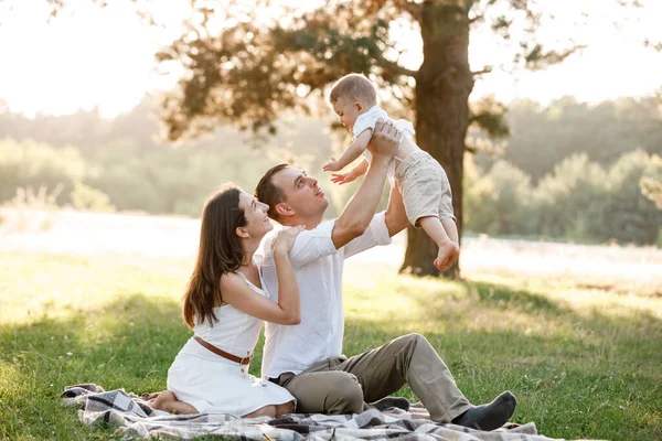 Mom Dad Lifts High His Baby Boy Mid Air Looks — Stock Photo, Image