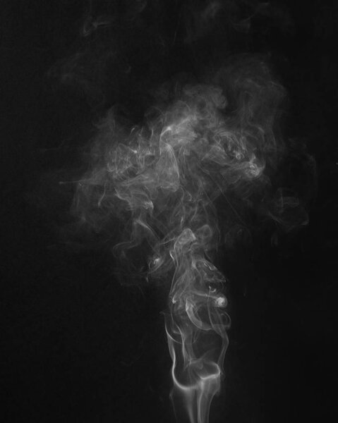Image of a white smoke on a black backround