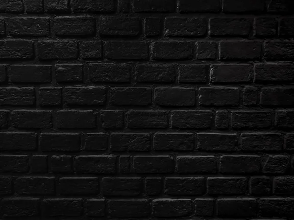 Black brick wall close up texture, brick surface for background. Vintage wallpaper.