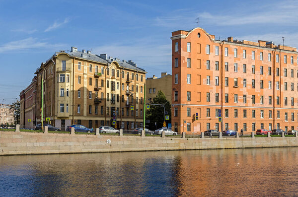 Saint Petersburg, Russia - September 9, 2018: Corner of Sadovaya Street and Fontanka river embankment with old residential buildings