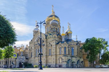 The orthodox Church of the Dormition of the Mother of God or Church of the Assumption of the Blessed Virgin Mary on the Lieutenant Schmidt embankment on the Vasilievsky Island in Saint Petersburg, Russia clipart