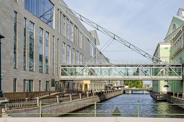 Saint Petersburg, Russia -  September 9, 2018: View from the Torgovy Bridge over the Kryukov Canal, the old building of the Mariinsky Theatre and the new building named The Second Stage, connected by the glass passageway