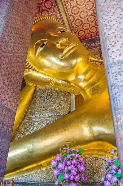 Reclining Buddha  in a Buddhist temple complex Wat Pho in Bangko