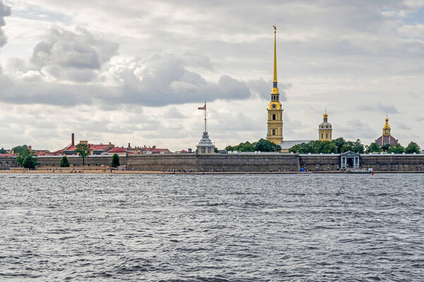 Saint Petersburg, Russia - July 25, 2019: Hare Island by the north bank of the Neva River and Peter and Paul Fortress, the original citadel founded by Peter the Great, with its public beach.