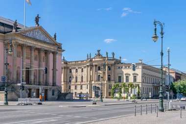 Unter der Linden boulevard and the Bebelplatz (colloquially the Opernplatz) with the State Opera building and the former Royal Library, now seat of the Humboldt University law faculty clipart
