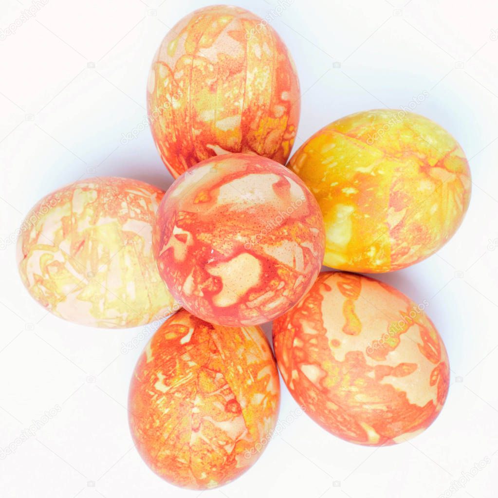 Easter eggs of different colors are placed in the form of a Chri